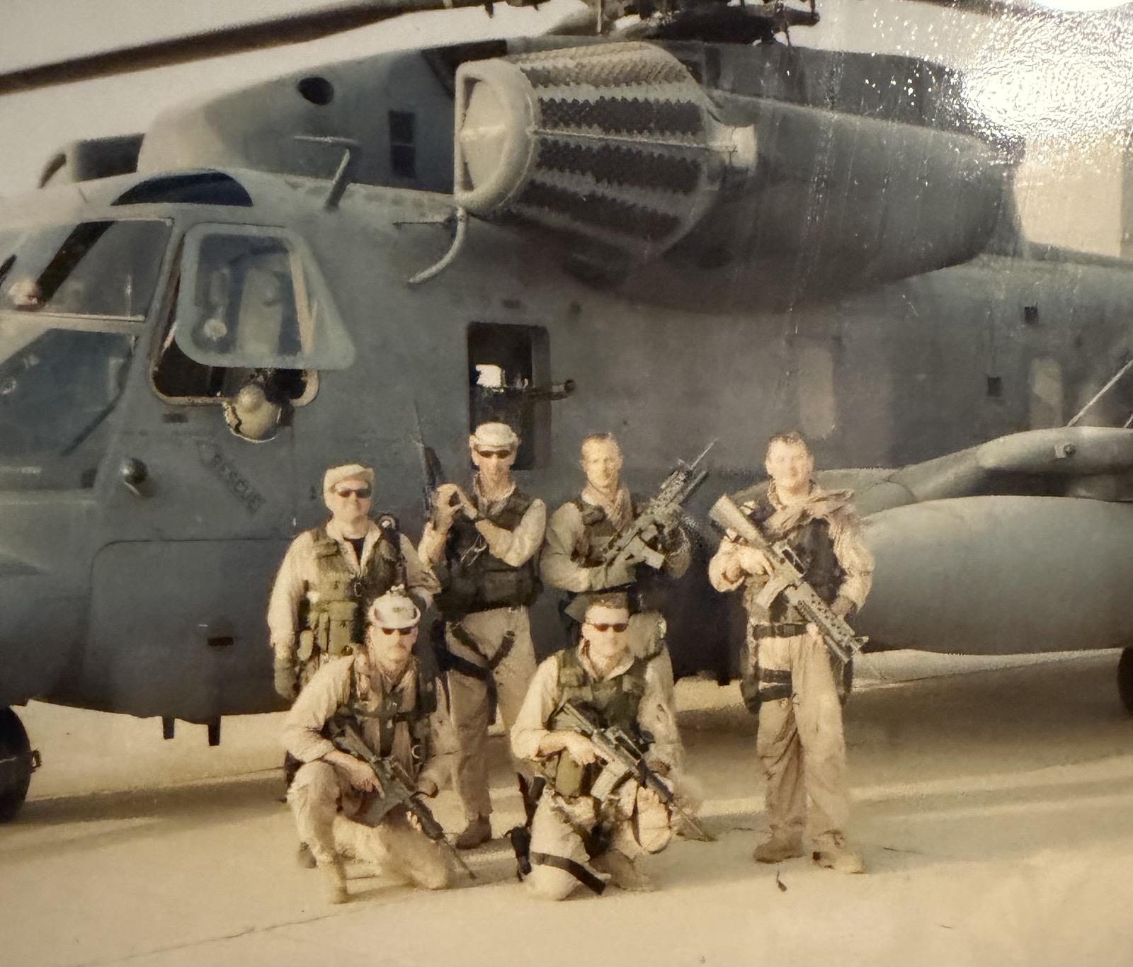 A group of men in uniform holding guns
