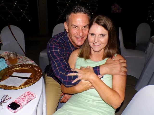 A man and woman hugging each other