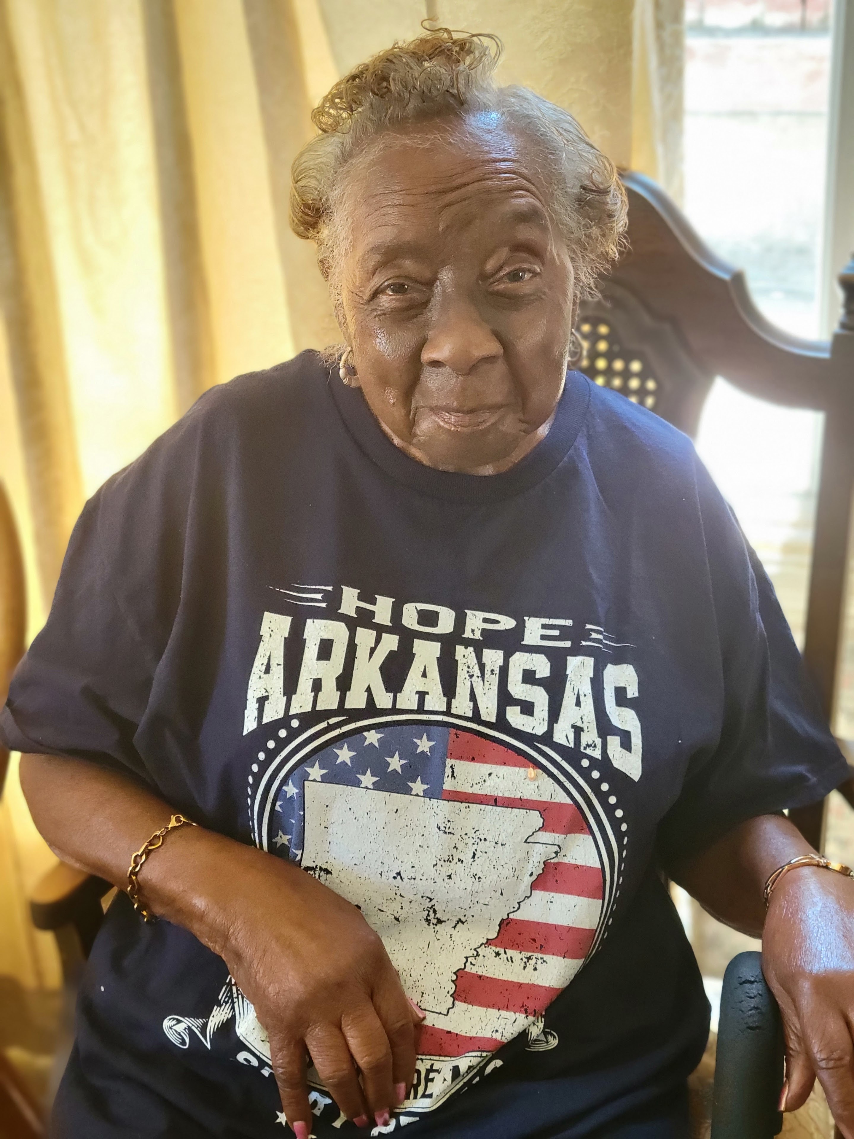 An old woman sitting in a chair