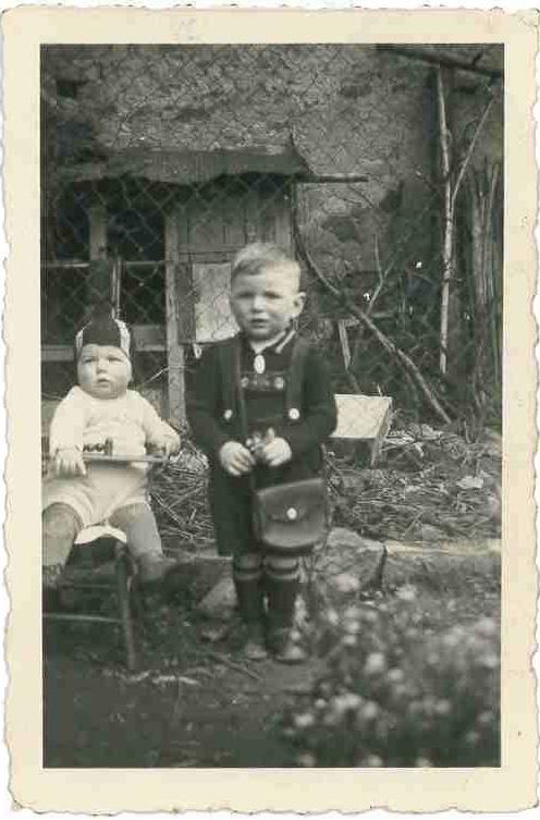 A black and white photo of two children
