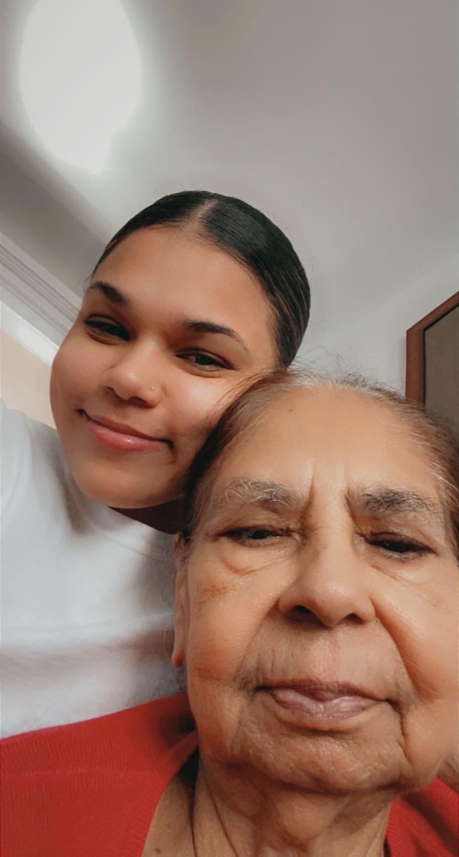 A woman and a woman taking a selfie
