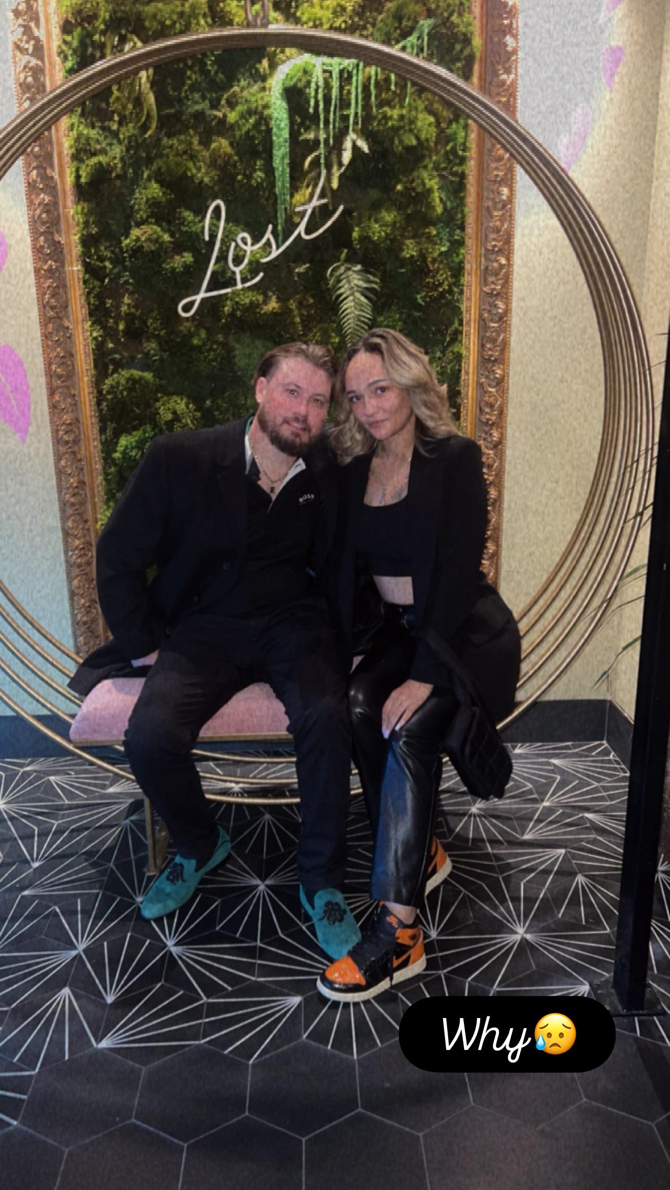 A man and woman sitting on a chair