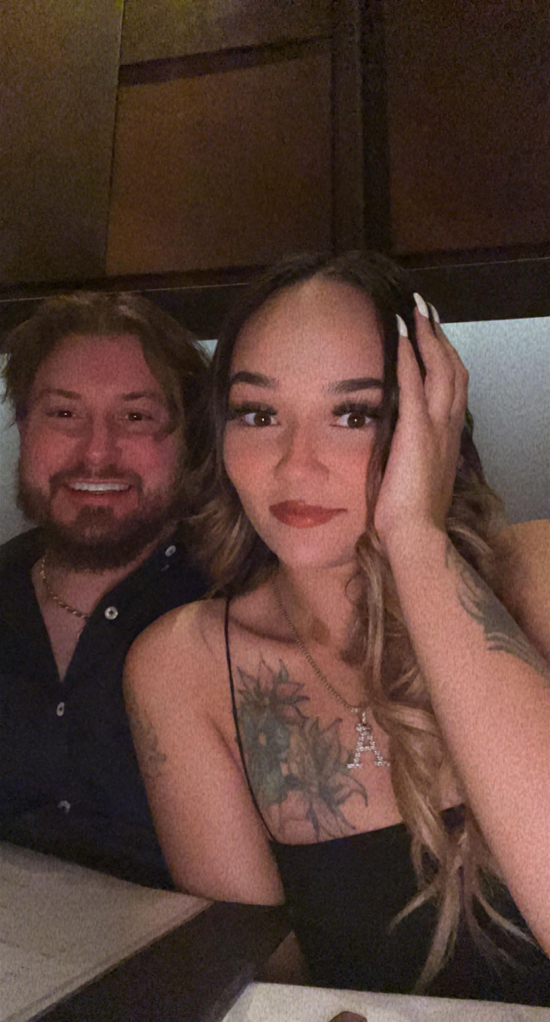A man and woman taking a selfie