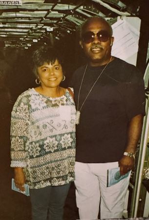 A man and woman posing for a picture