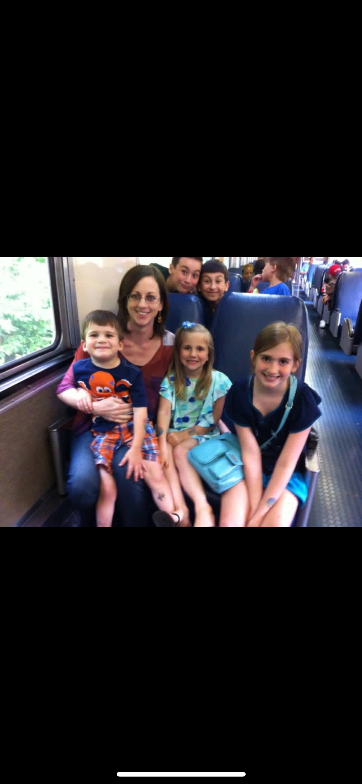 A group of people sitting on a train