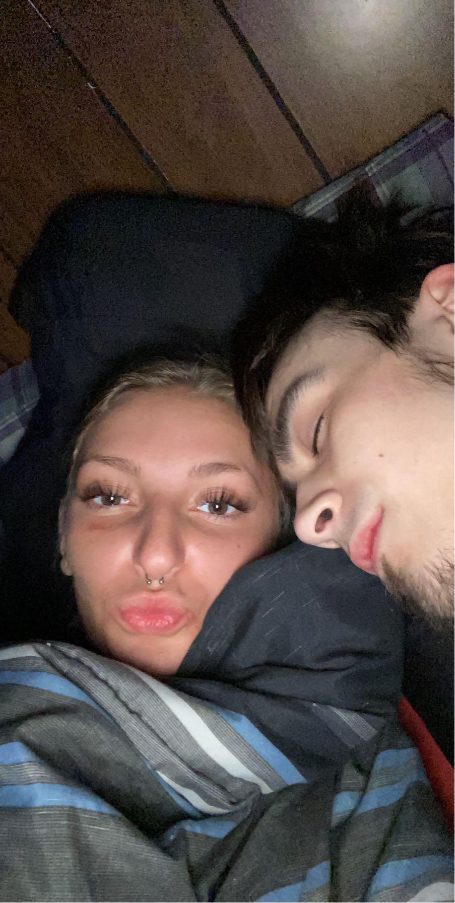 A man and woman taking a selfie