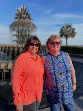 Two women standing next to each other