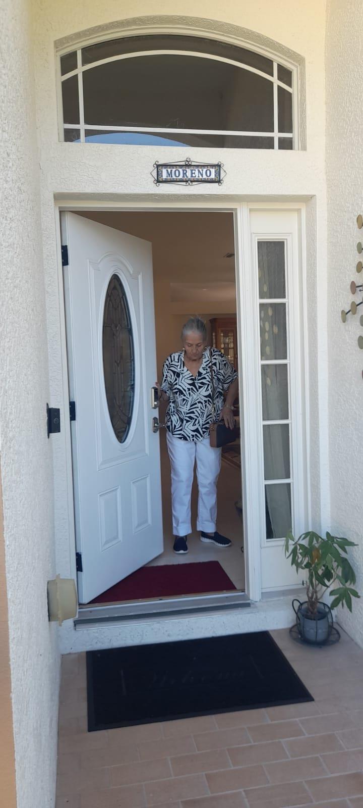 A woman walking into a door