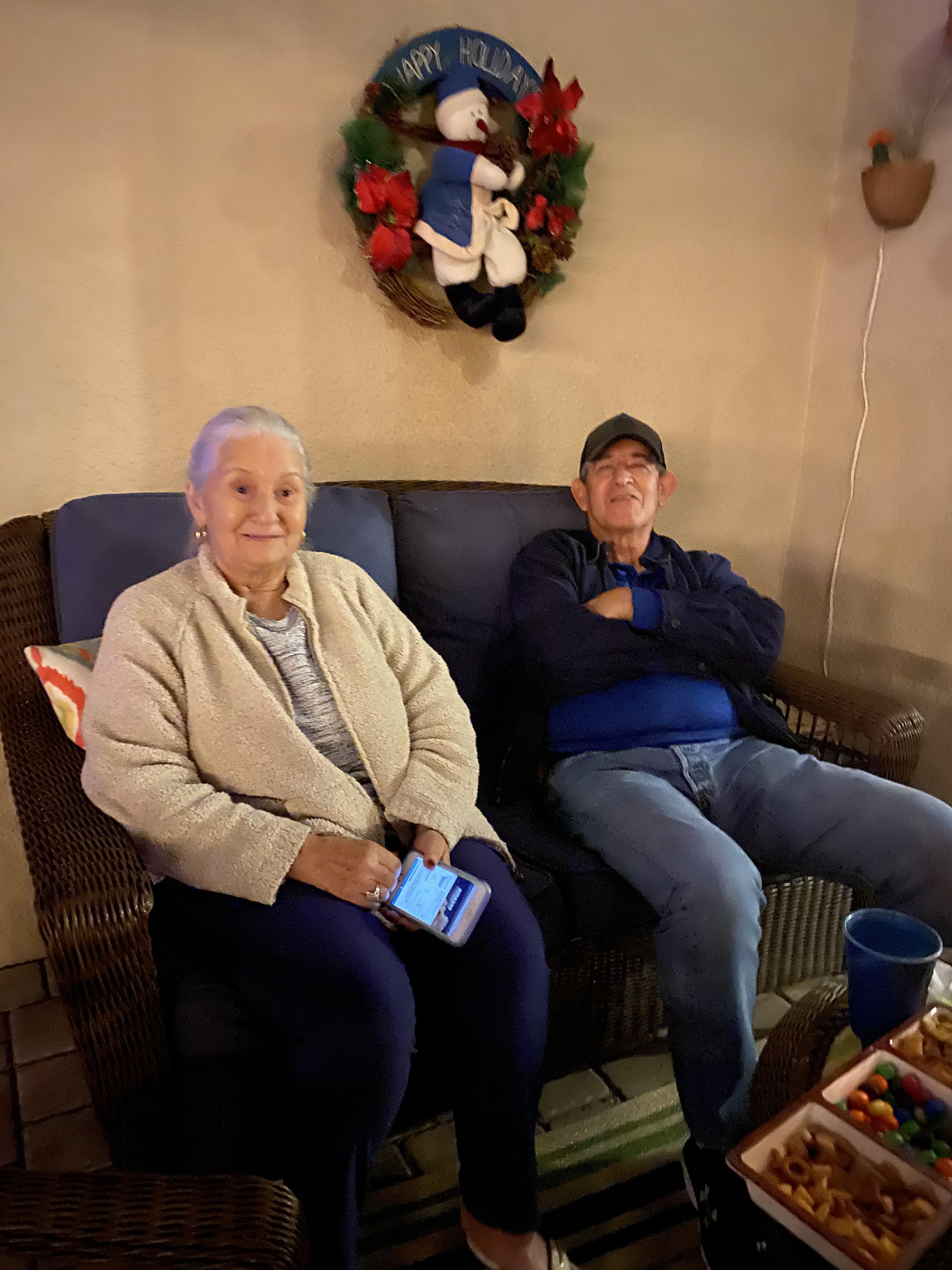 A man and woman sitting on a couch