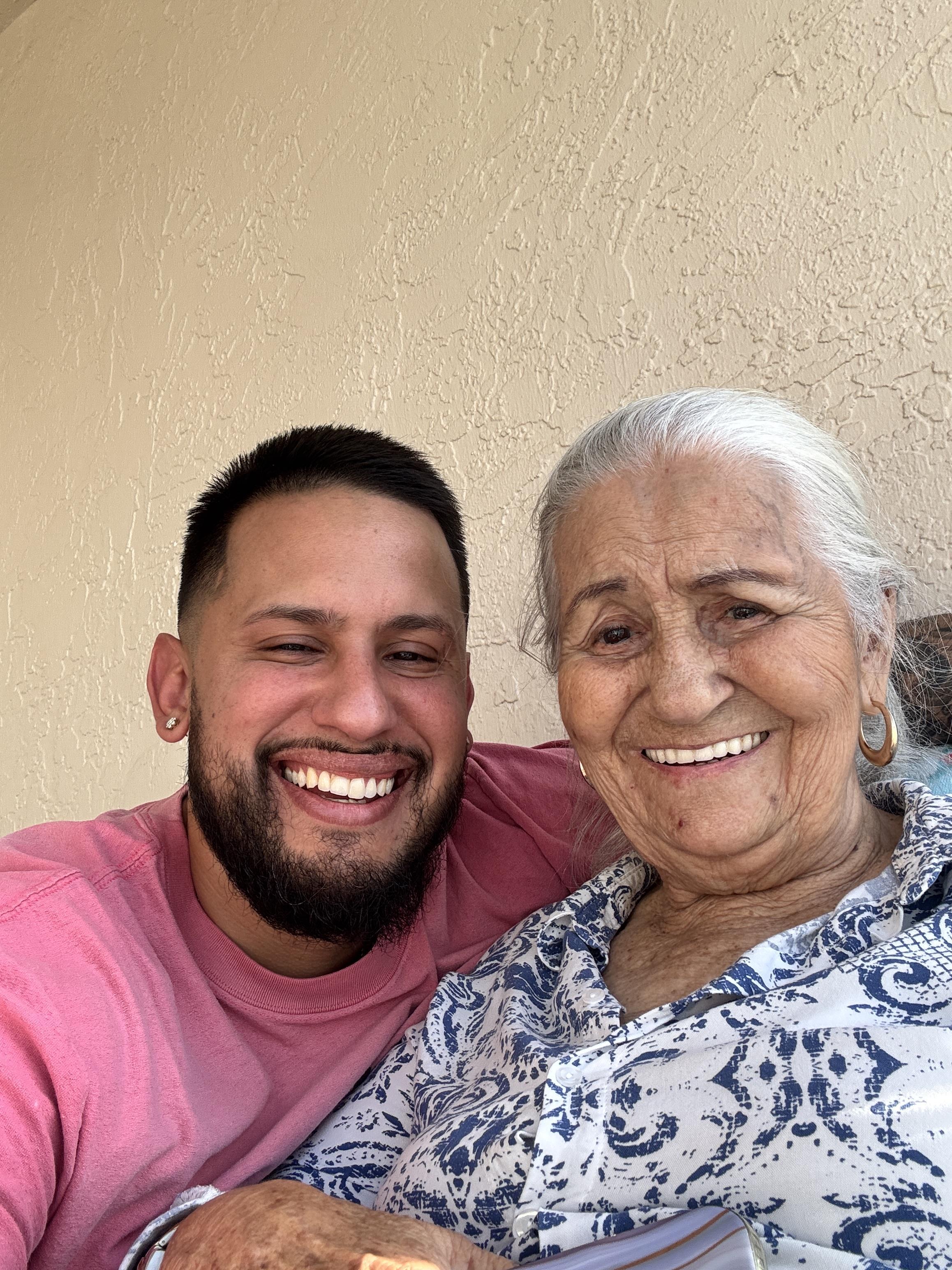 A man and woman smiling for a selfie