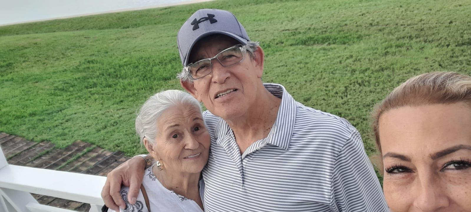 A man and woman posing for a picture