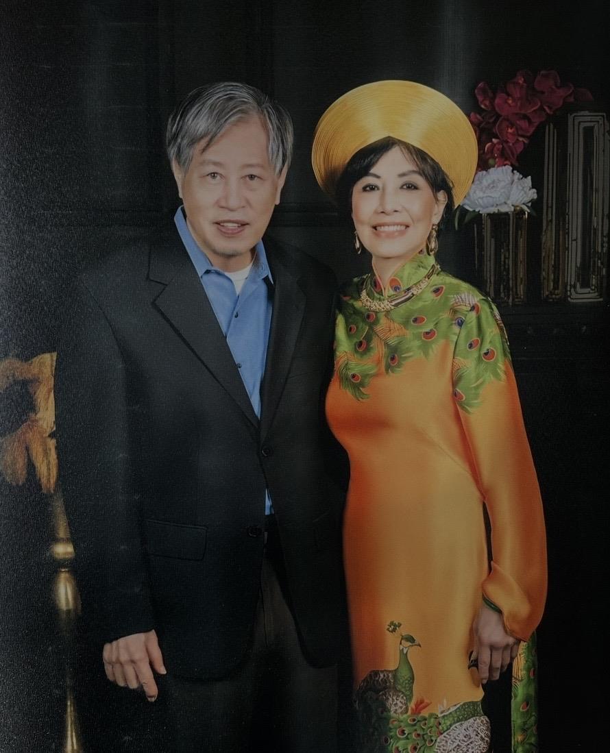 A man and woman posing for a picture