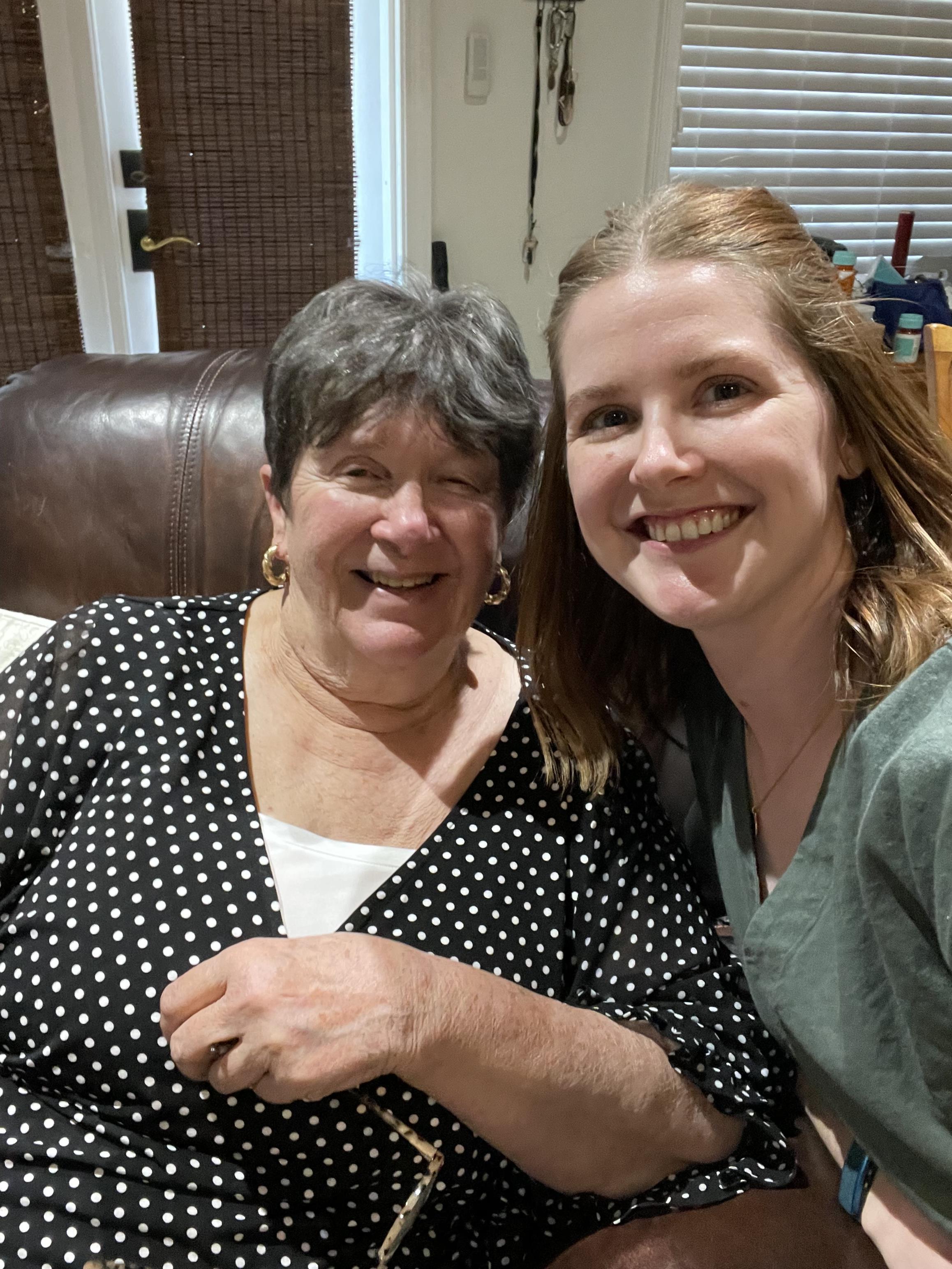 A woman and a woman smiling