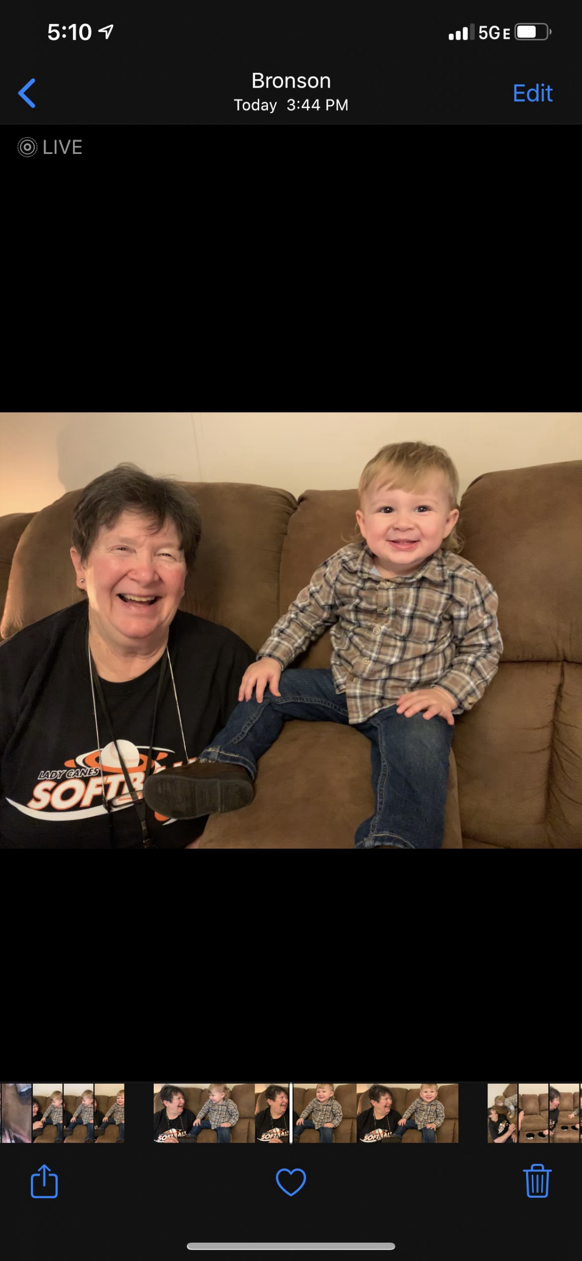 A woman and a child sitting on a couch