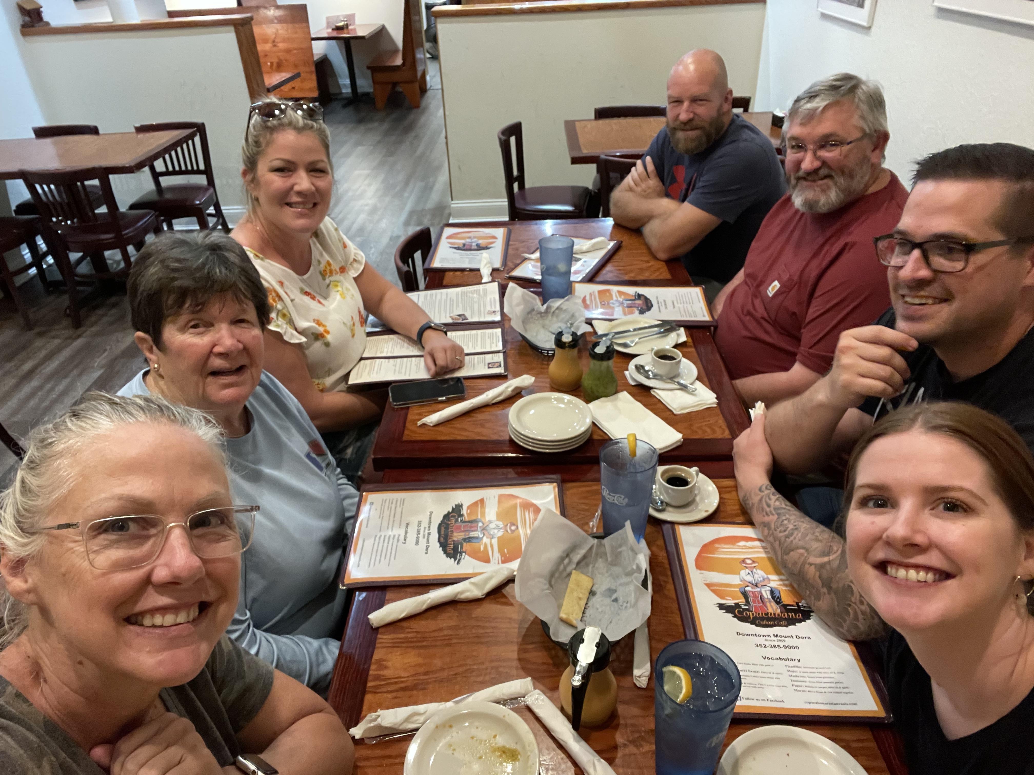 A group of people sitting at a table