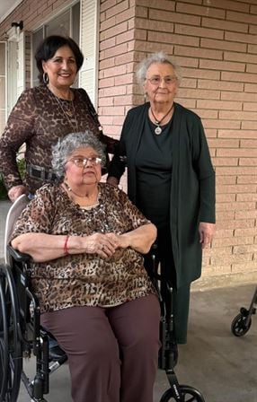 A group of women standing next to each other