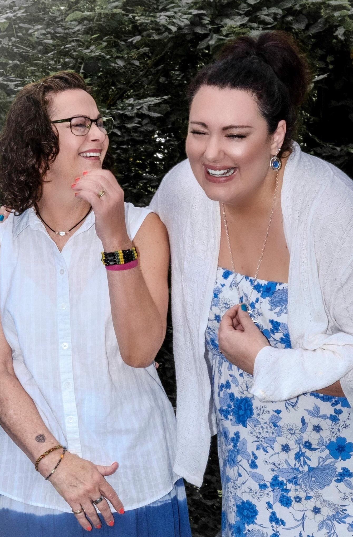 Two women laughing and laughing