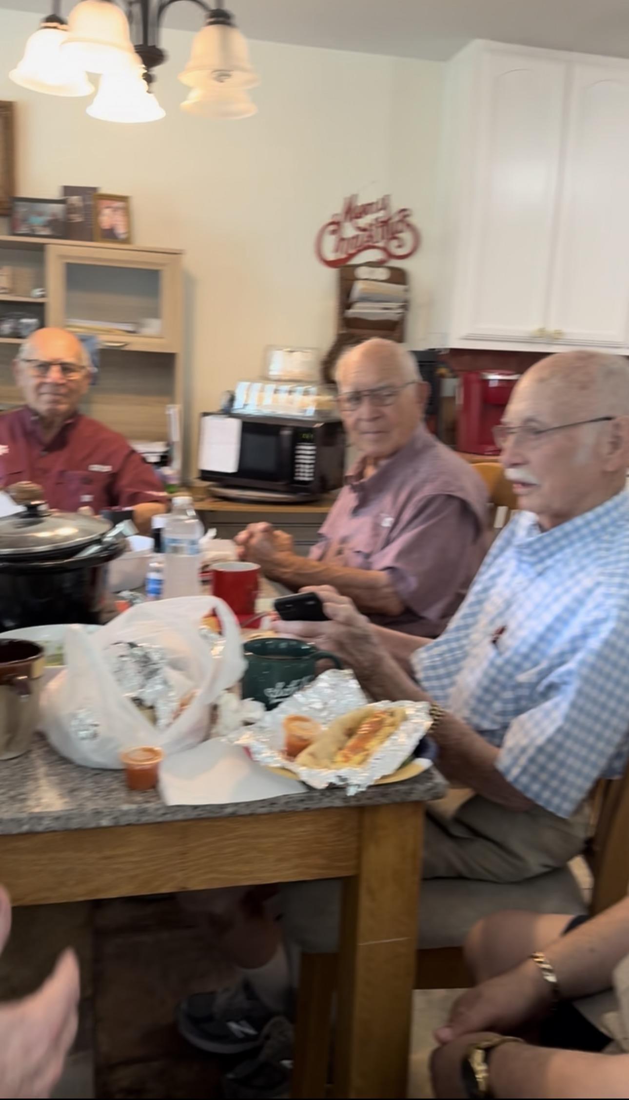 A group of men sitting at a table