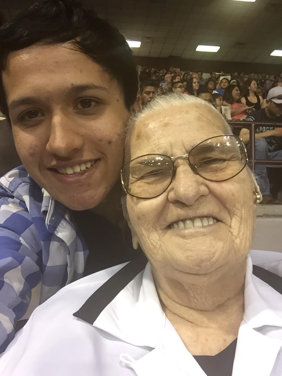 A boy and an old woman taking a selfie