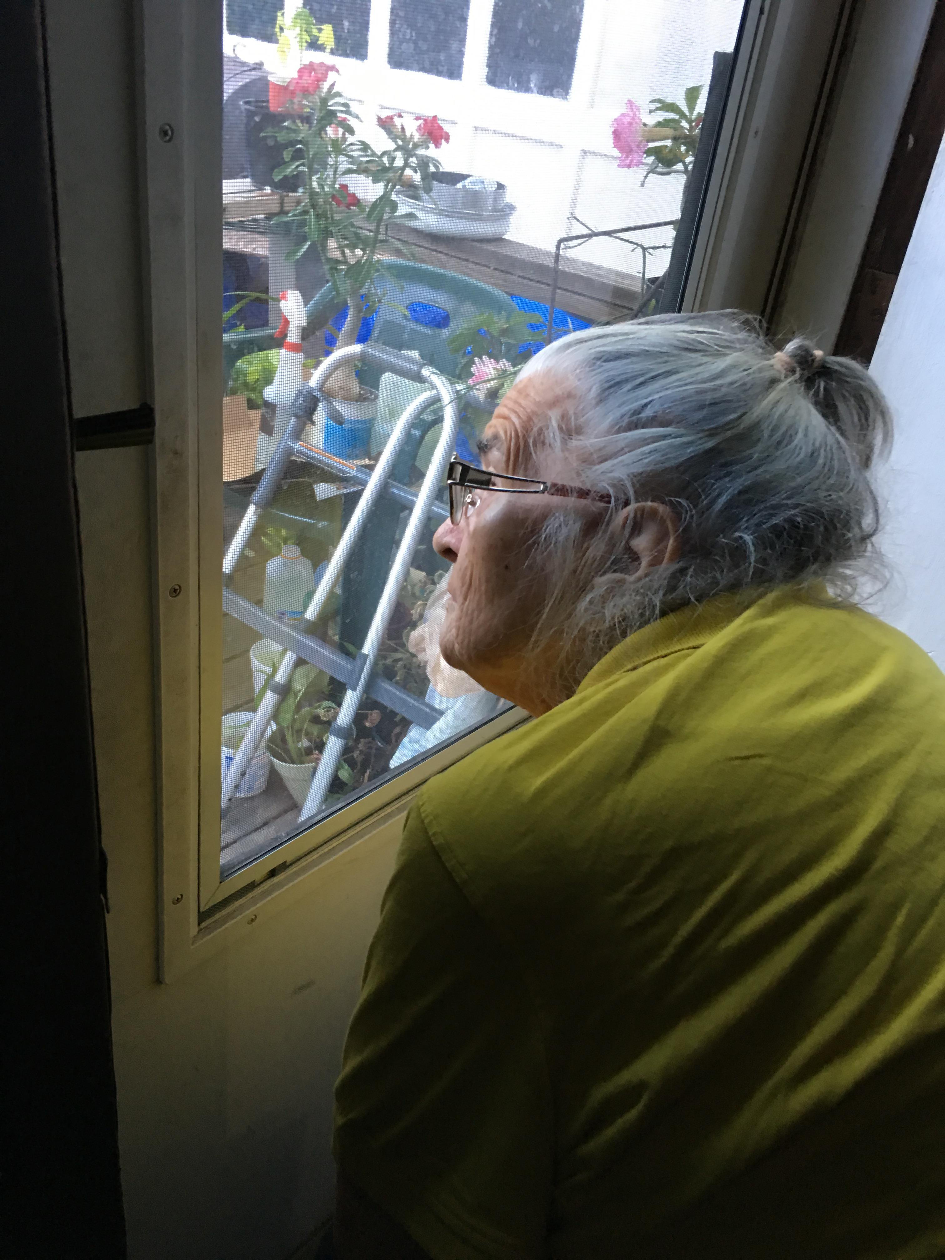 A woman looking out a window