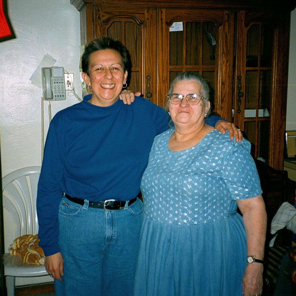 A woman and man posing for a picture