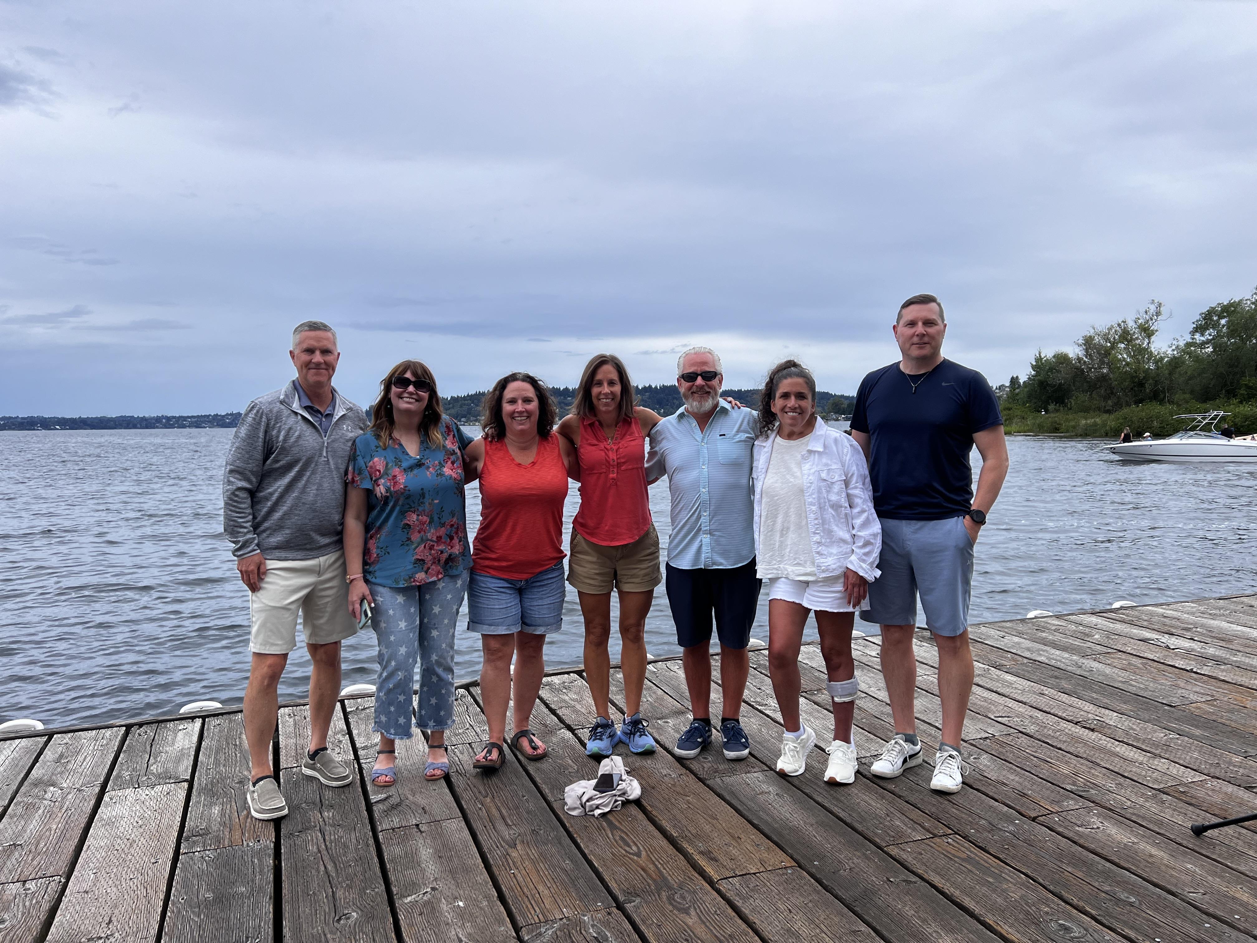 A group of people standing on a dock