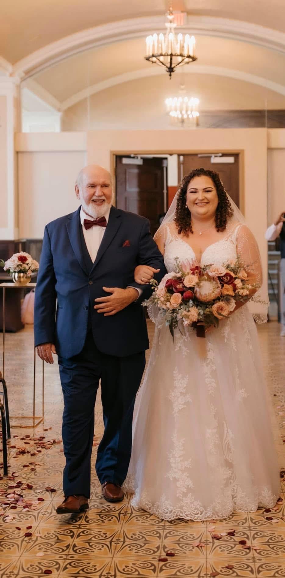 A man in a suit and a woman in a wedding dress