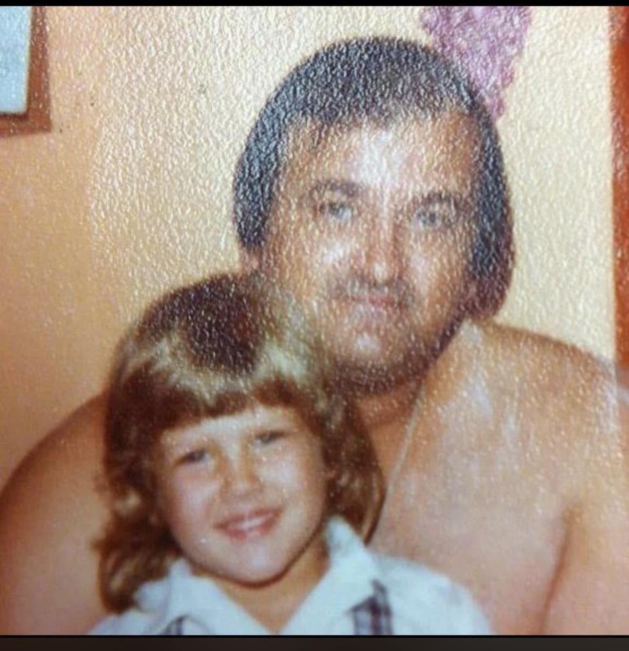 A man and child posing for a picture