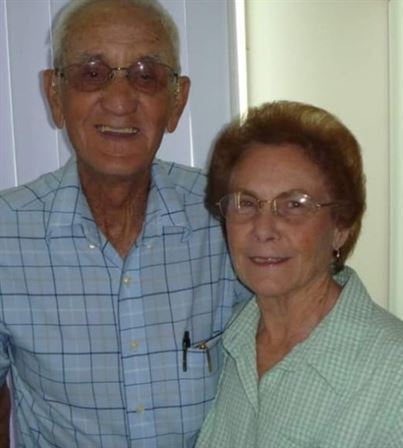 A man and woman posing for a picture