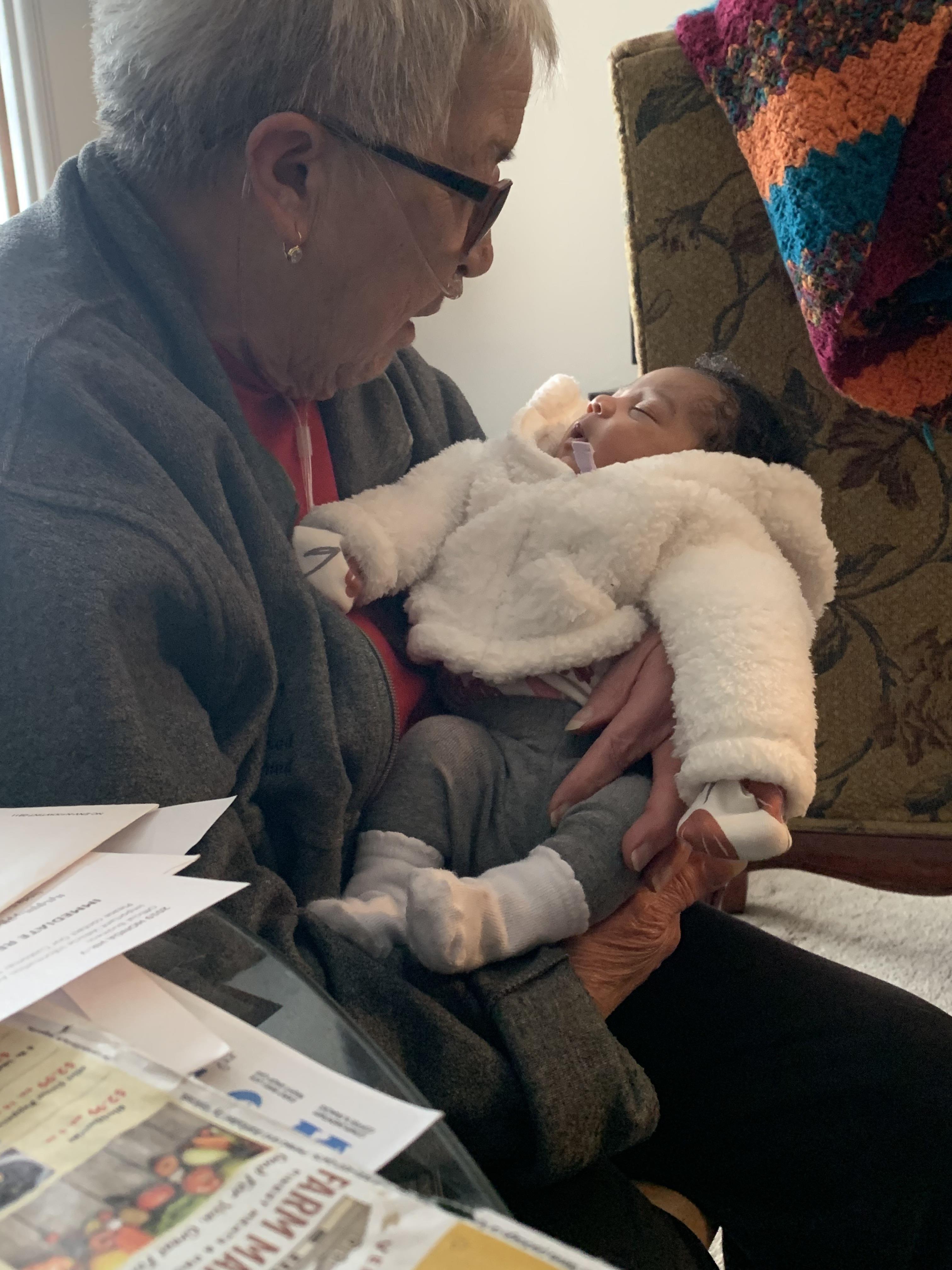 A woman holding a baby