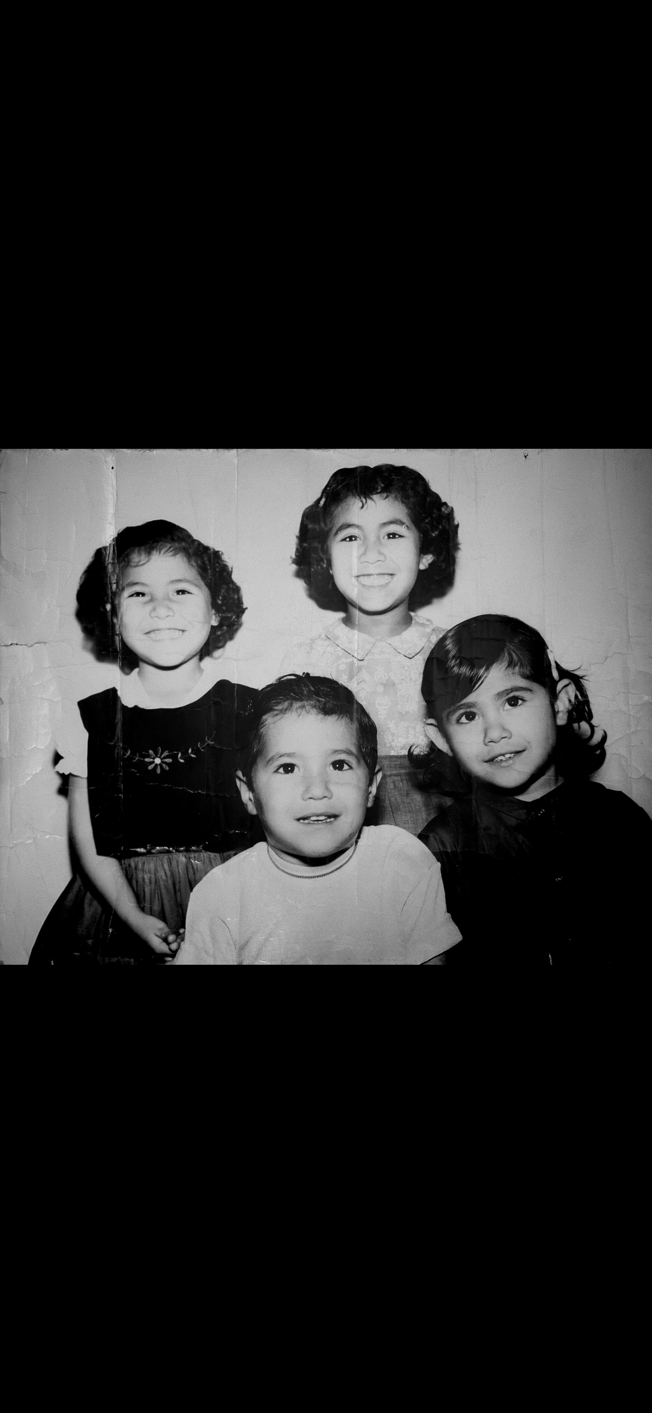 A group of children posing for a photo