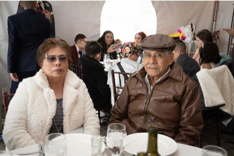 A man and woman sitting at a table