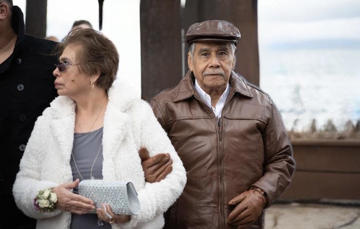 A man and woman standing next to each other
