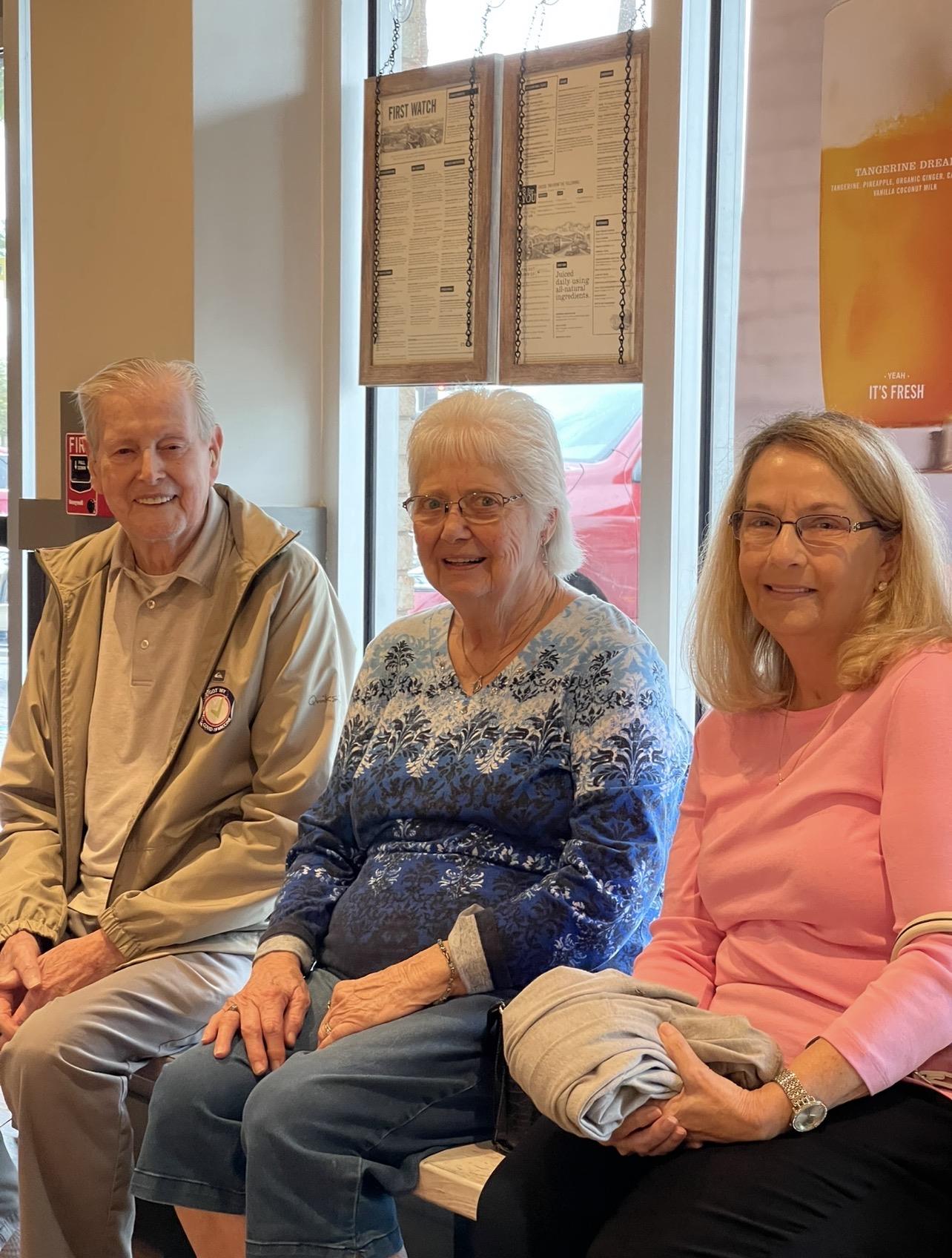 A group of people sitting in a room