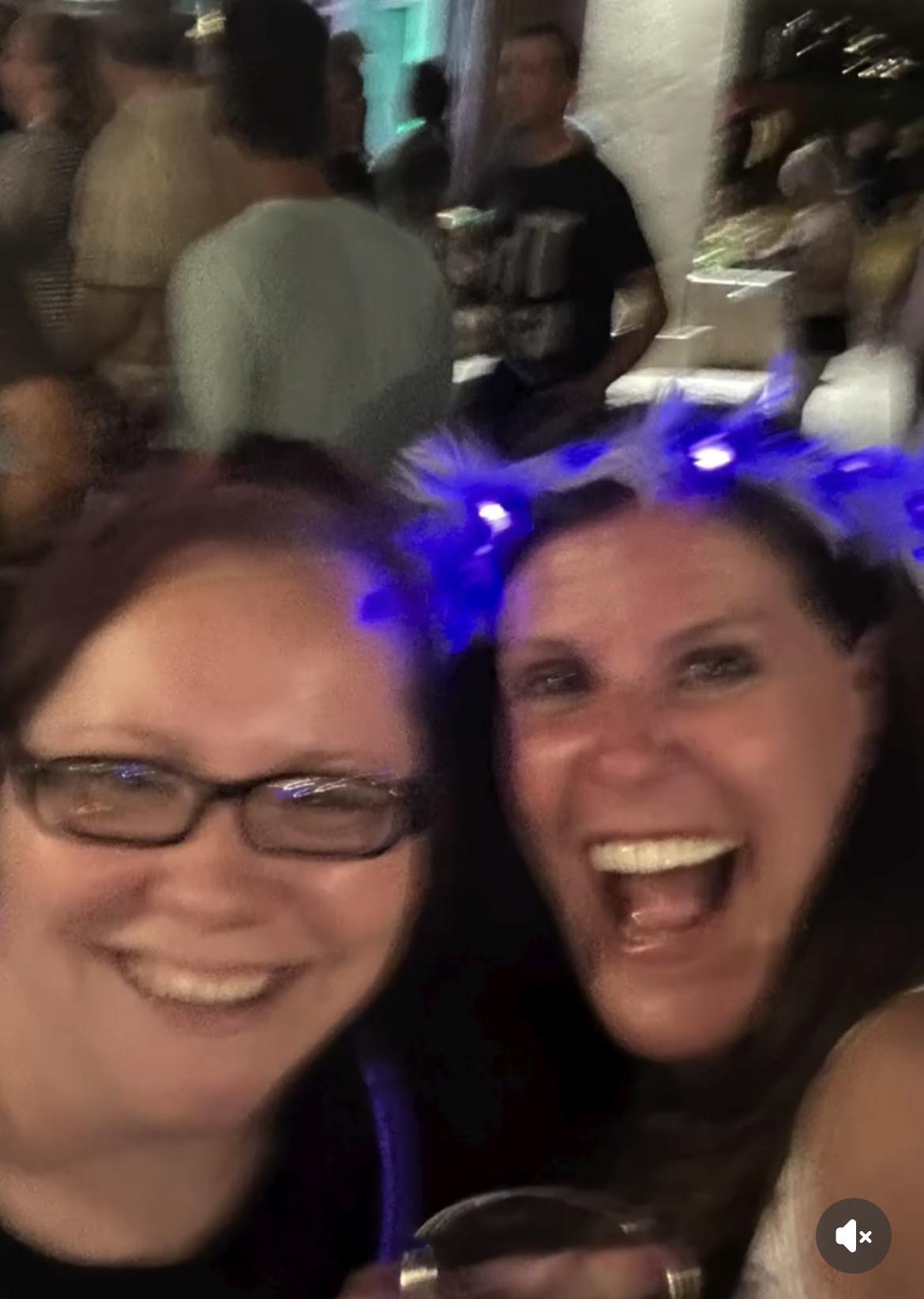 Two women smiling at the camera