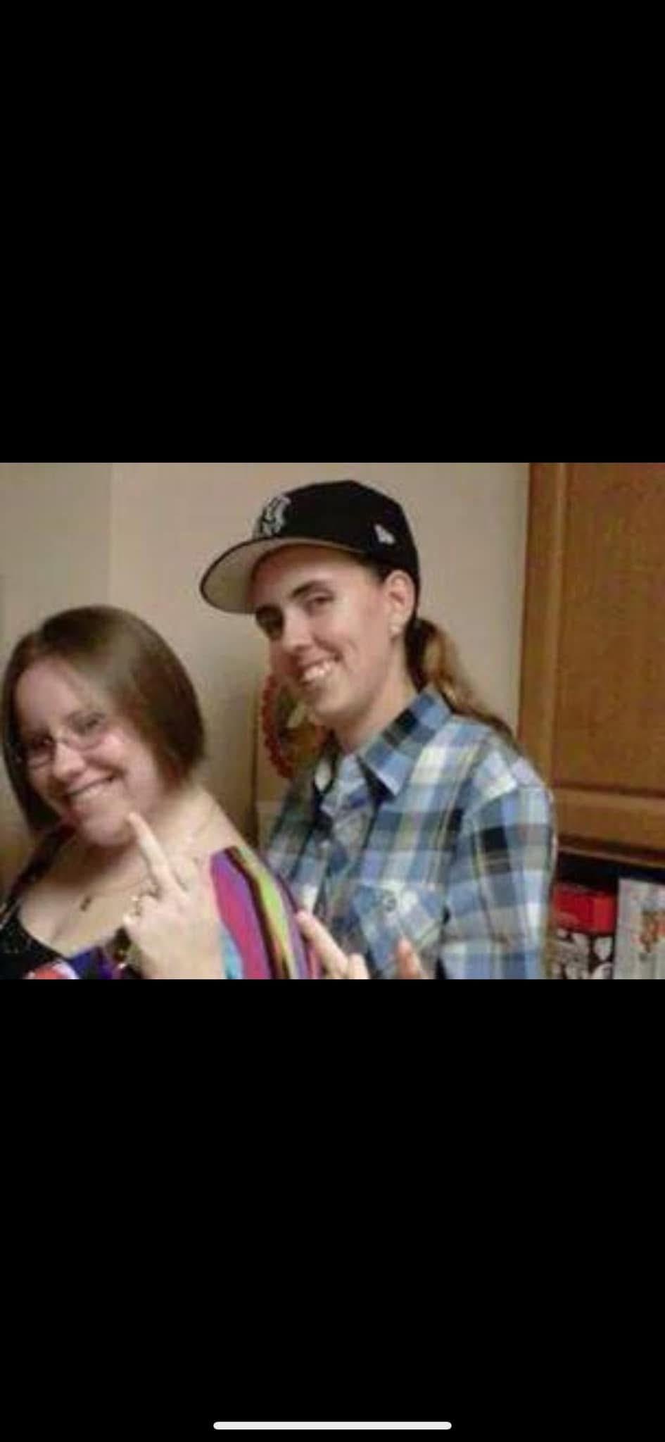 A man and woman posing for a picture