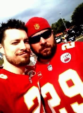 Two men wearing football jerseys