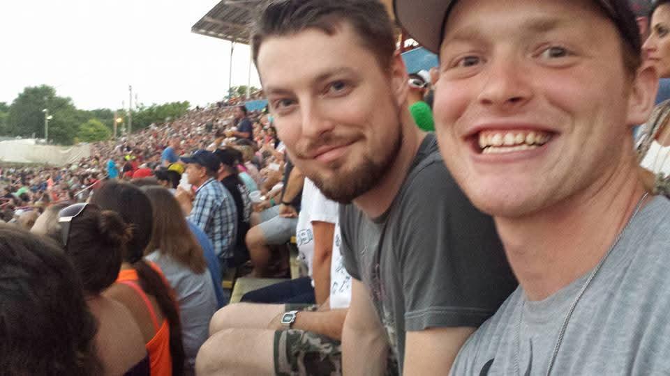 A group of men sitting in a stadium