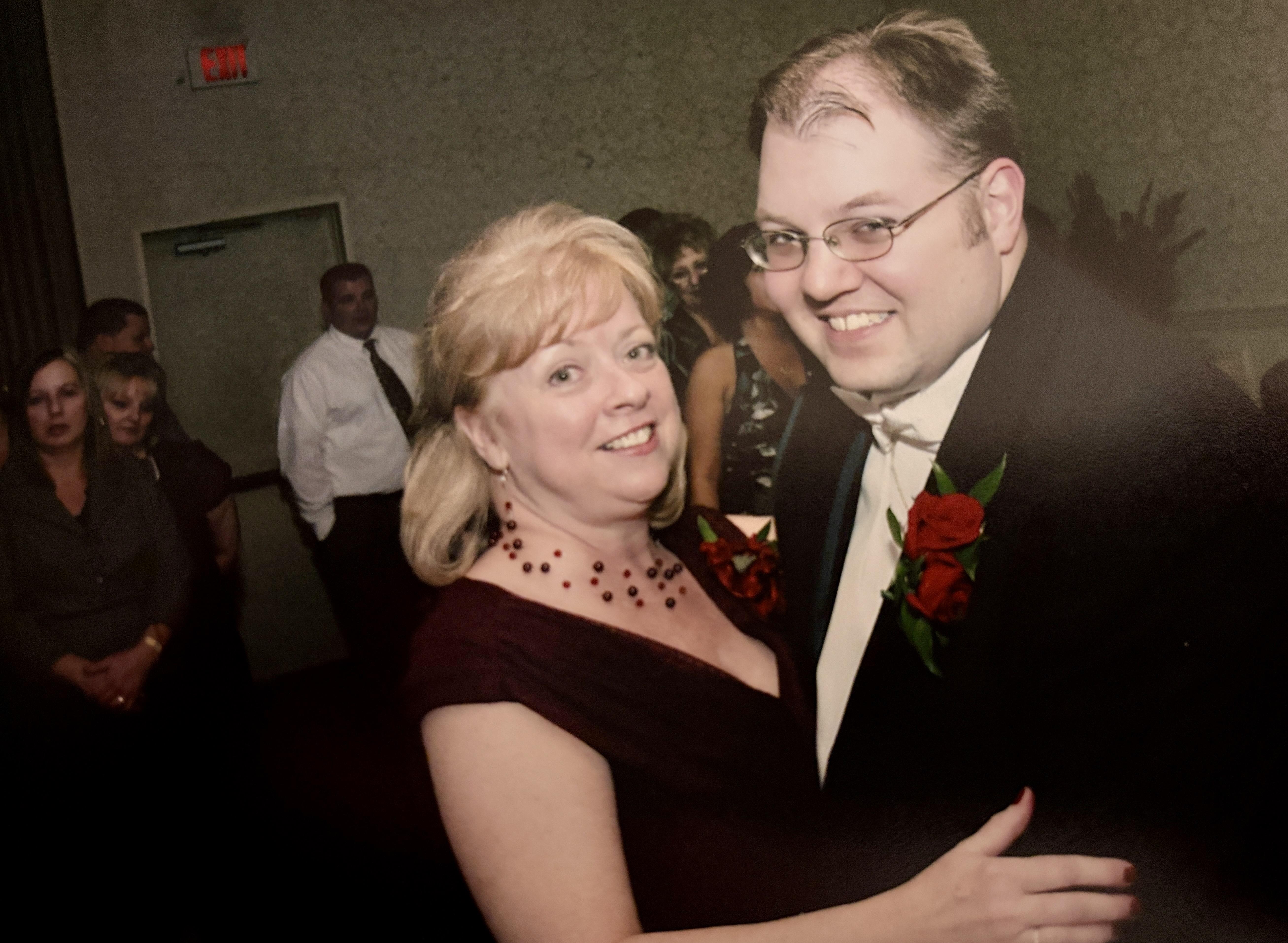 A man and woman posing for a picture