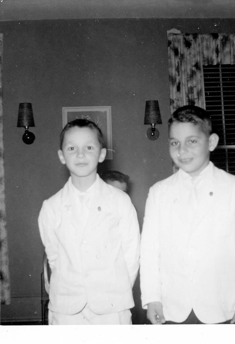 A couple of boys in white shirts