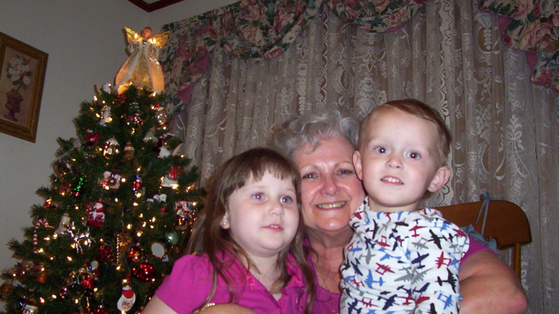 A woman and children posing for a picture