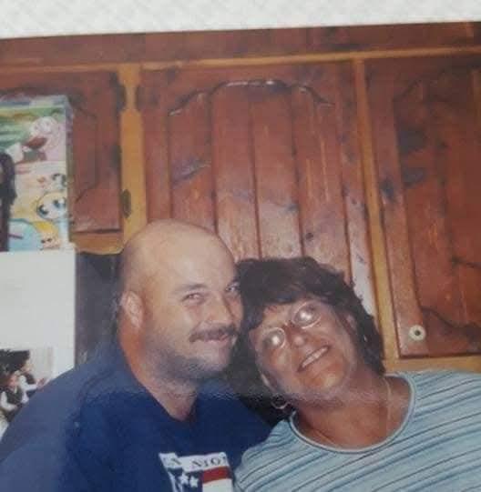 A man and woman posing for a picture