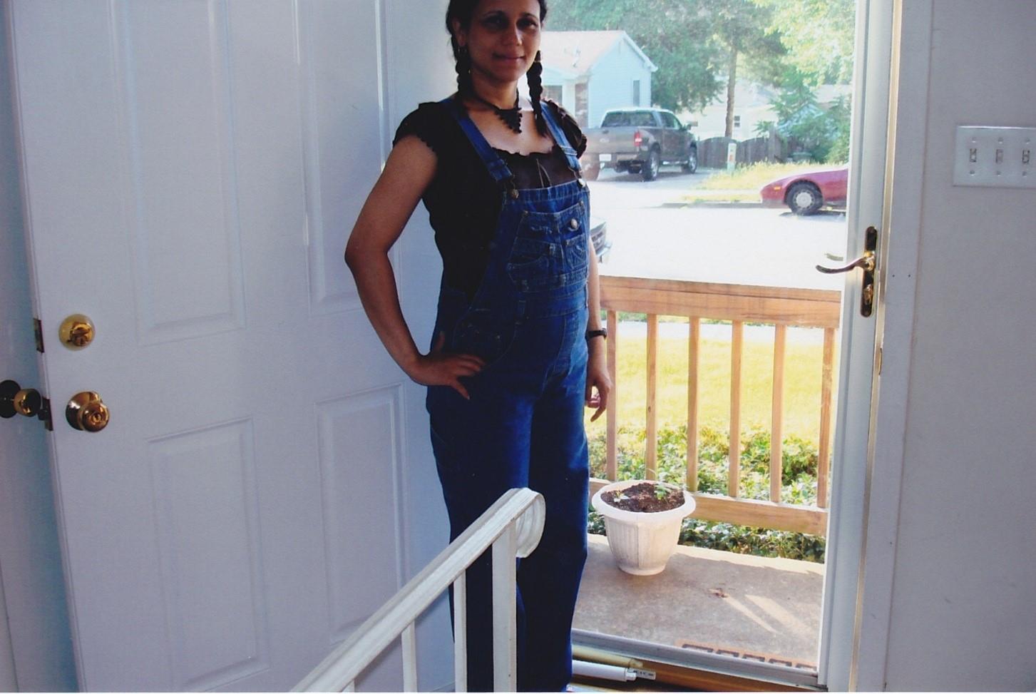 A woman standing in front of a door
