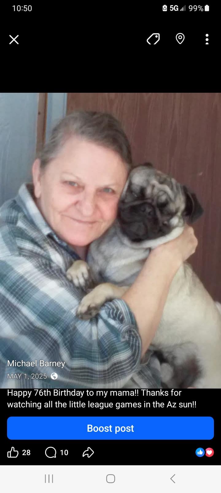 A woman holding a dog