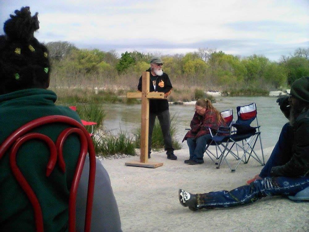A man speaking to a group of people