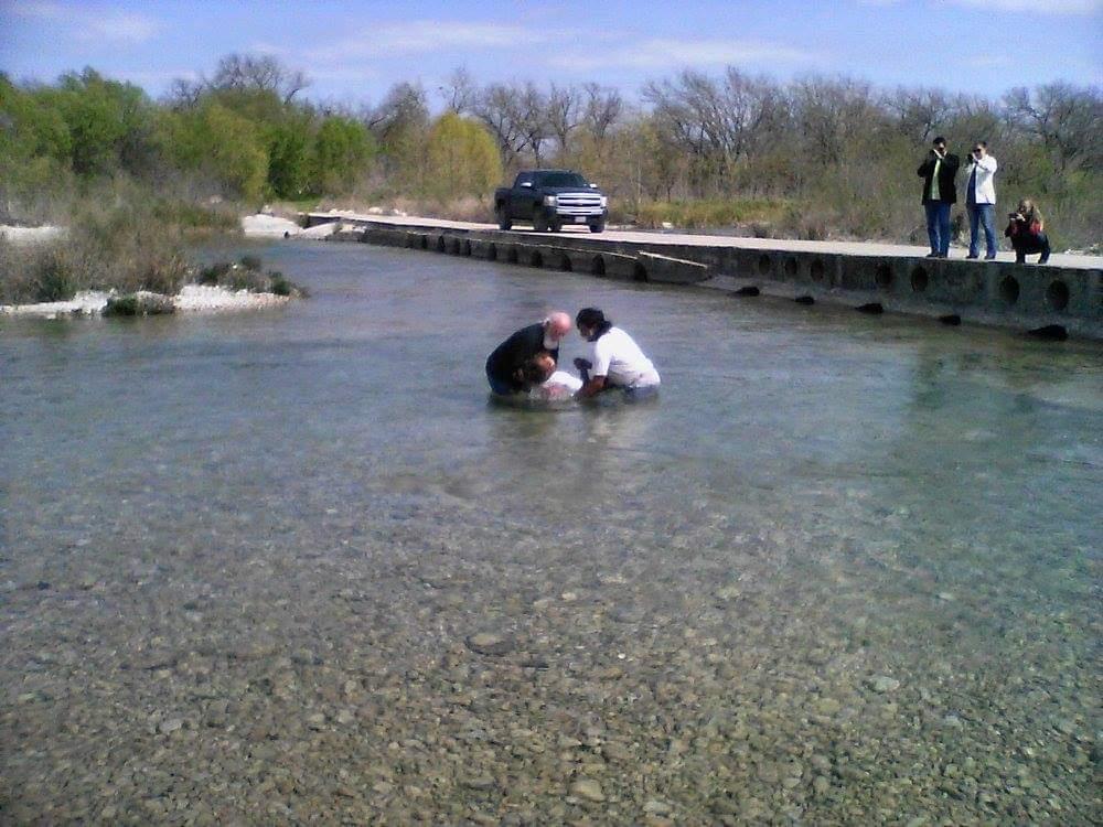 A man and woman in a river