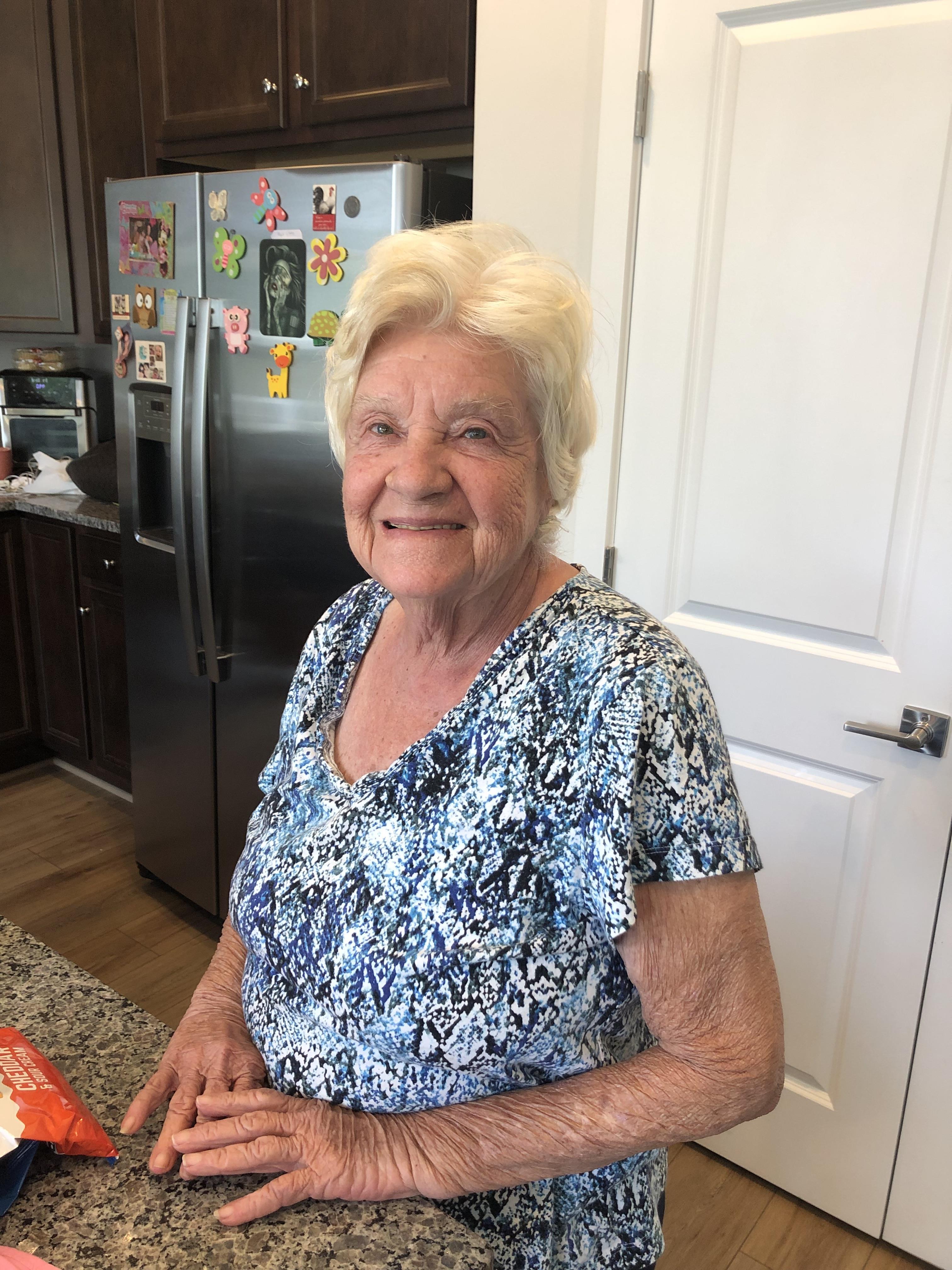 A woman sitting in a kitchen