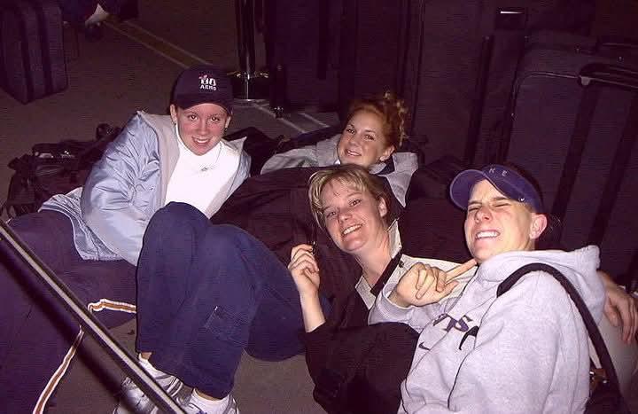A group of people sitting on the ground