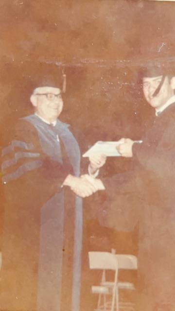 A man shaking hands with another man