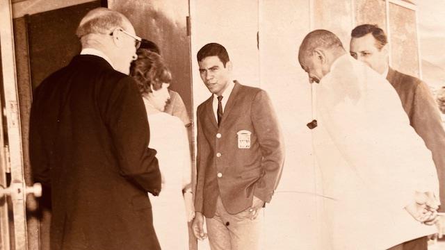 A group of people standing in a room